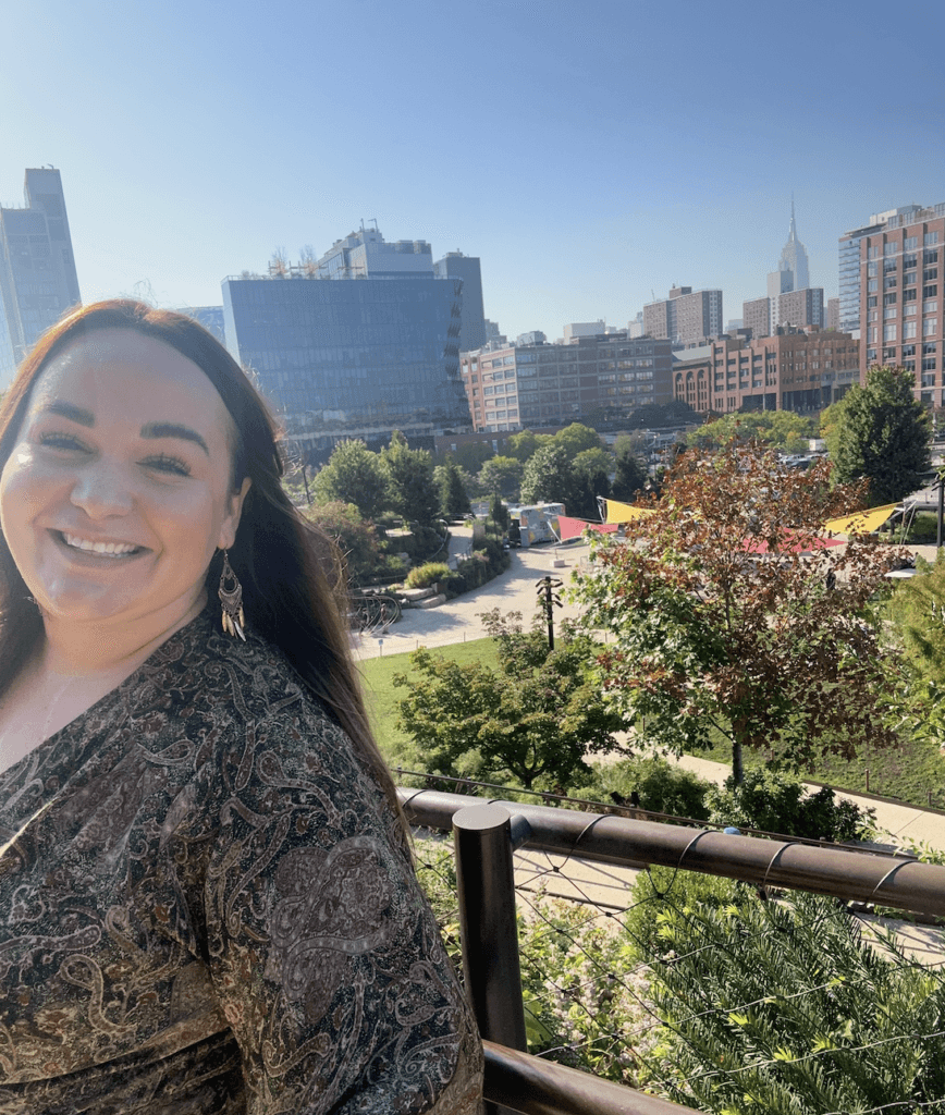 Ellie in Little Island Park, with the Empire State Building in the background. 