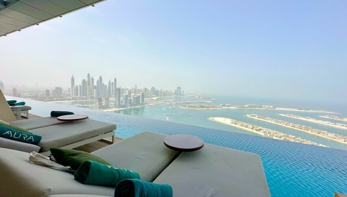 sun loungers at the aura sky pool dubai