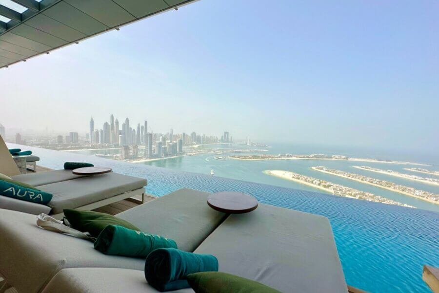 sun loungers at the aura sky pool dubai