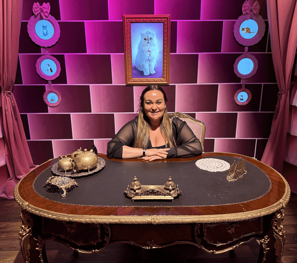 Ellie sat in Umbridge's office at the Harry Potter exhibition