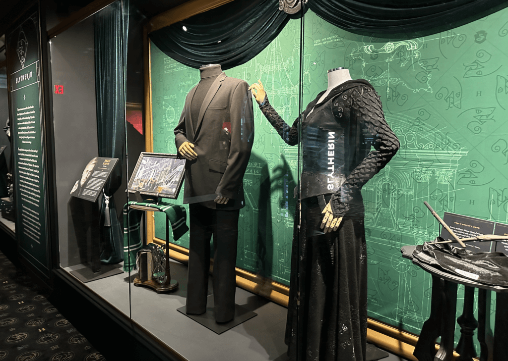 slytherin costumes inside Harry Potter: The Exhibition NYC