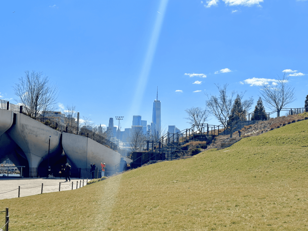 the freedom tower, seen from Little island in new york city