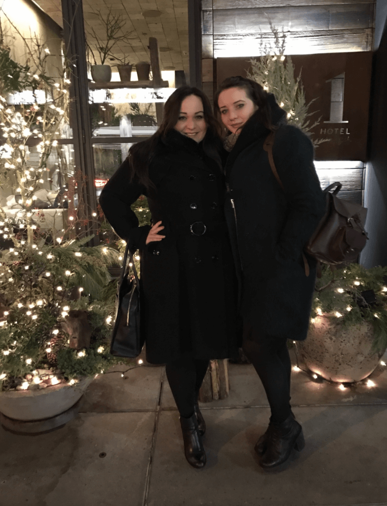 Ellie and her sister in a formal dress in NYC