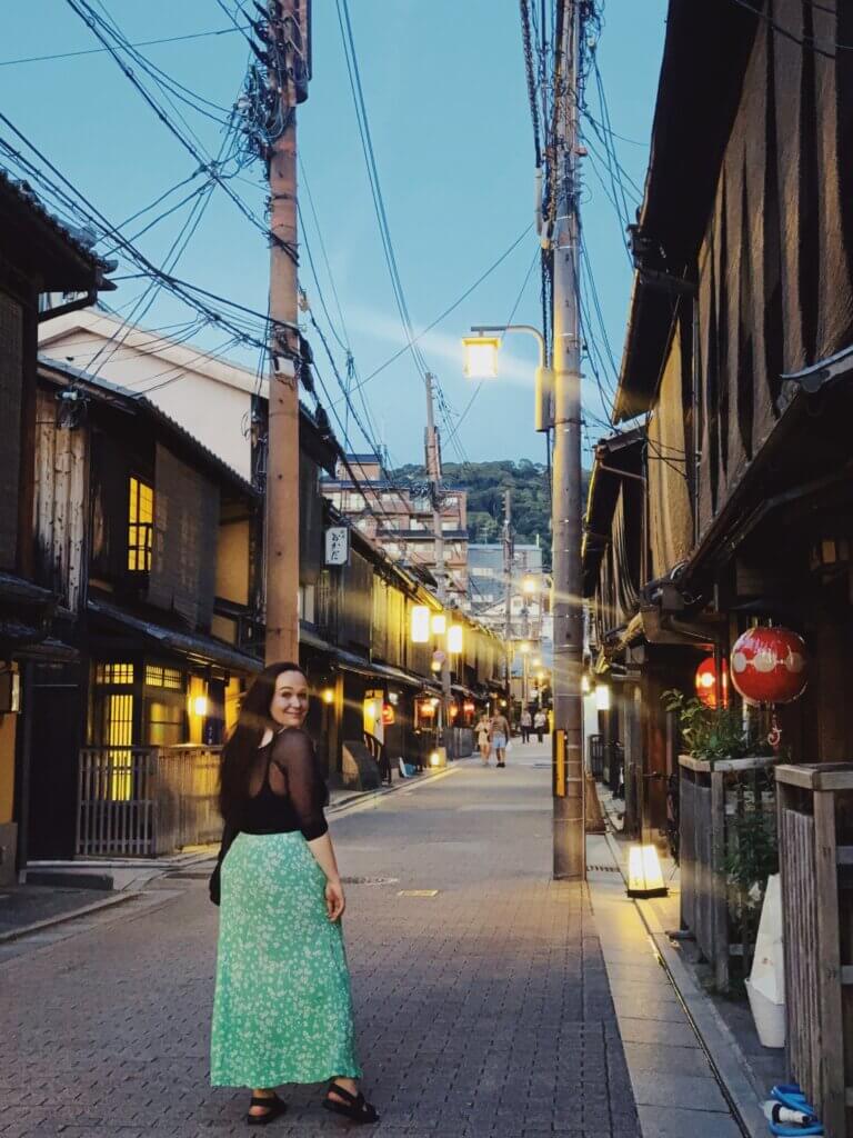 Ellie walking through Kyoto at dusk