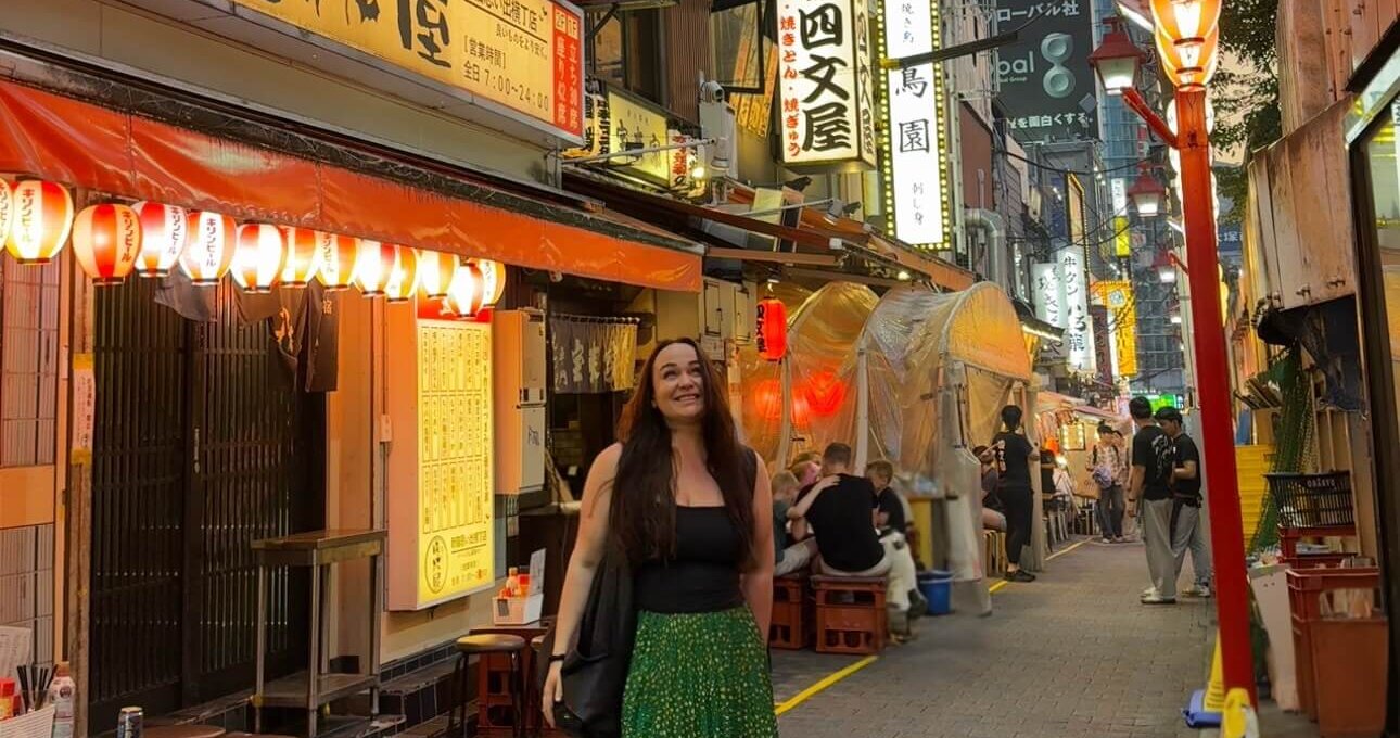 Ellie stood in a small Tokyo alleyway