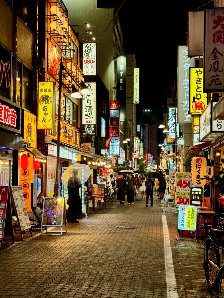 Busy bright tokyo street at night
