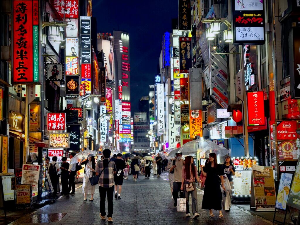 Busy bright tokyo street at night